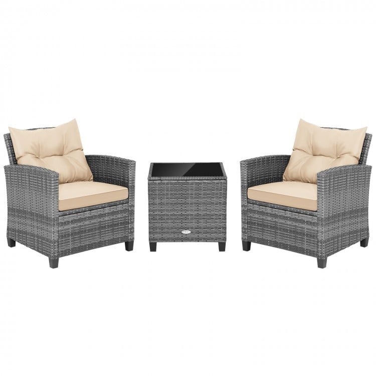 Two chairs with beige cushions and a compact glass-top table in a 3-piece outdoor wicker conversation set.