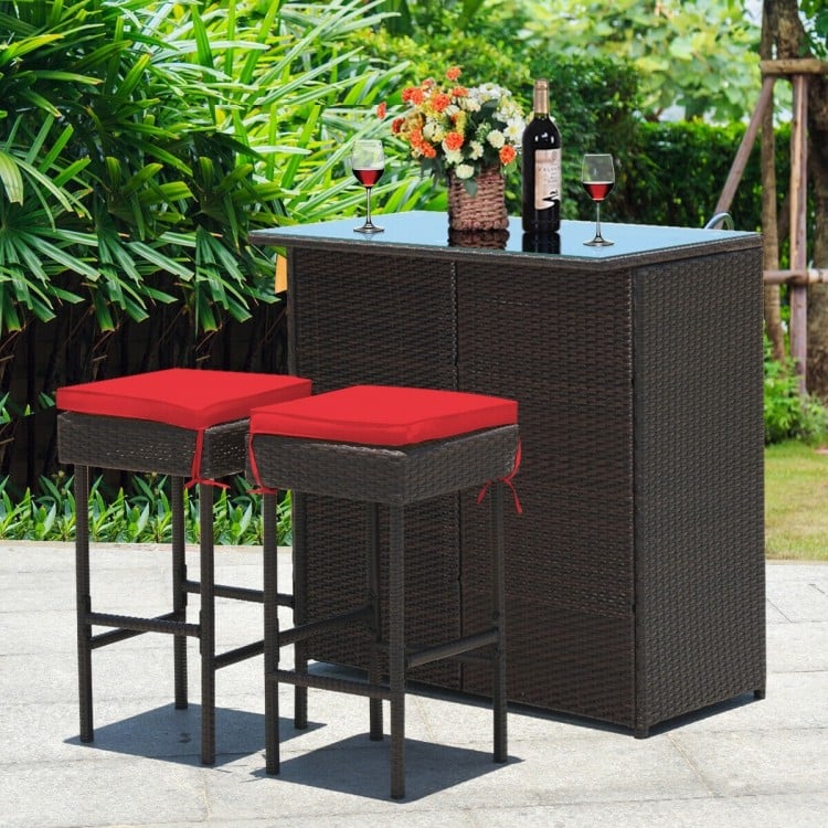 Red cushioned stool from the patio wicker bar set, featuring a durable PE wicker design and string ties for secure.