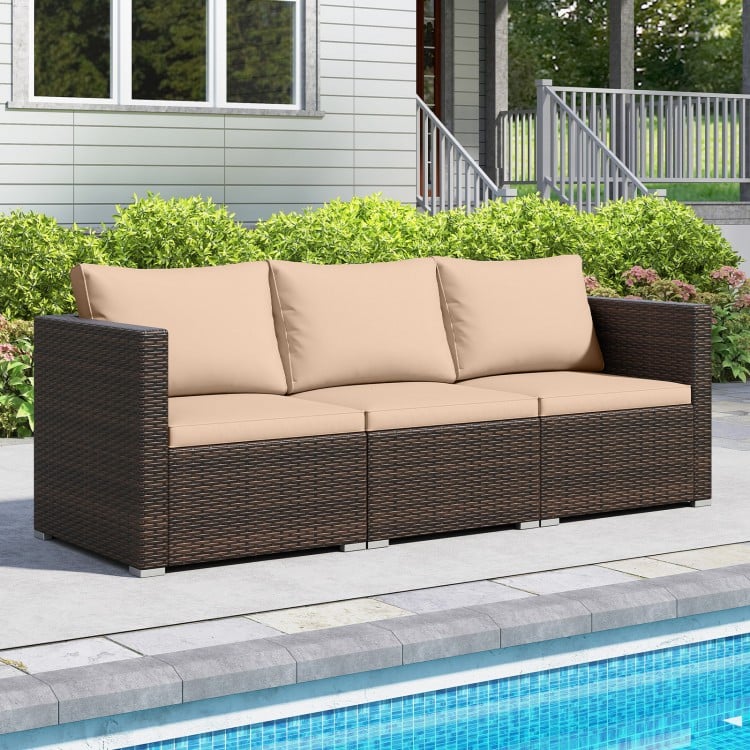 Three-piece patio sectional sofa set with beige cushions, made of hand-woven PE rattan, ideal for poolside relaxation.