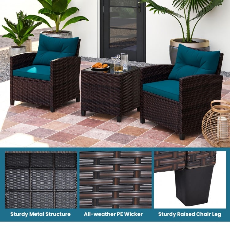 Two chairs with peacock blue cushions and a coffee table, featuring sturdy metal and all-weather PE wicker for outdoor.