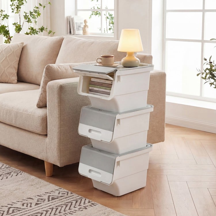 Stackable gray plastic storage bins with wheels and stay-open lids, perfect for organizing kitchens and bedrooms.