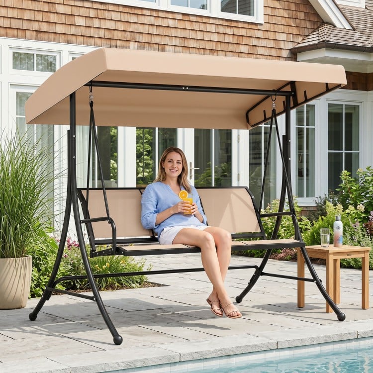 3-seat patio swing chair with adjustable beige canopy, perfect for outdoor relaxation by the pool.