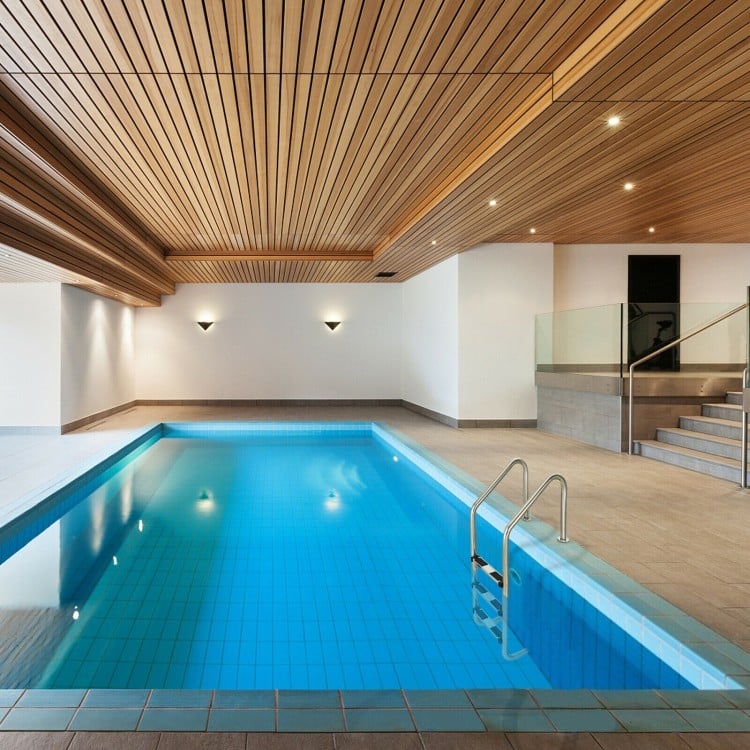 3-step stainless steel swimming pool ladder with anti-slip steps, designed for safety and stability in indoor pools.