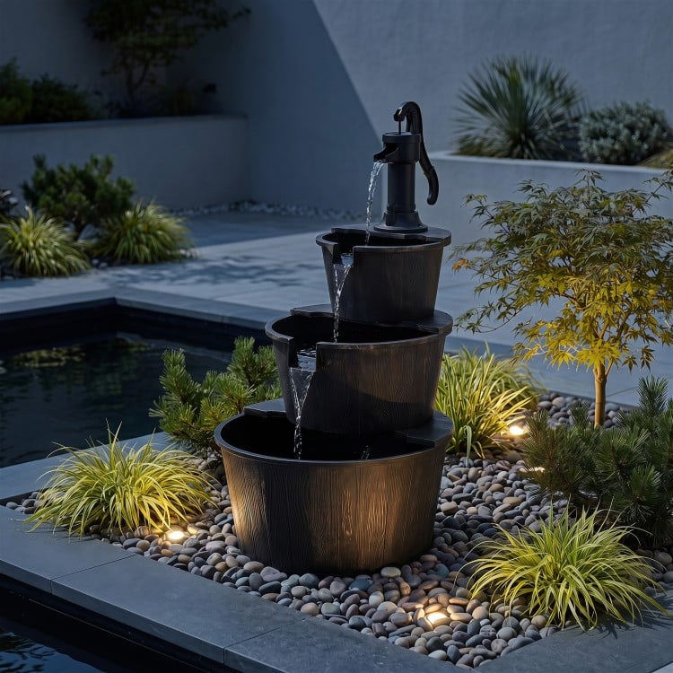Three-tier outdoor barrel waterfall fountain with vintage bronze finish, cascading water, and electric pump for garden relaxation.