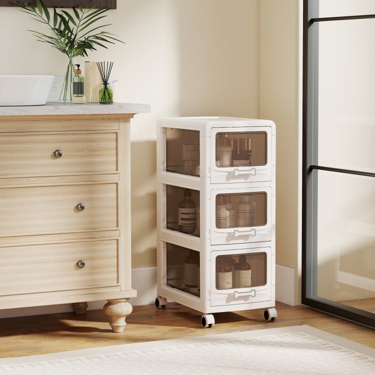 3-tier white plastic drawer storage organizer cart with lockable wheels, perfect for organizing supplies in any room.