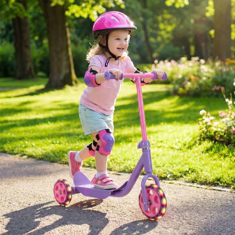 Child riding a purple 3-wheel scooter with LED light-up wheels, designed for stability and safety for kids age 2+.