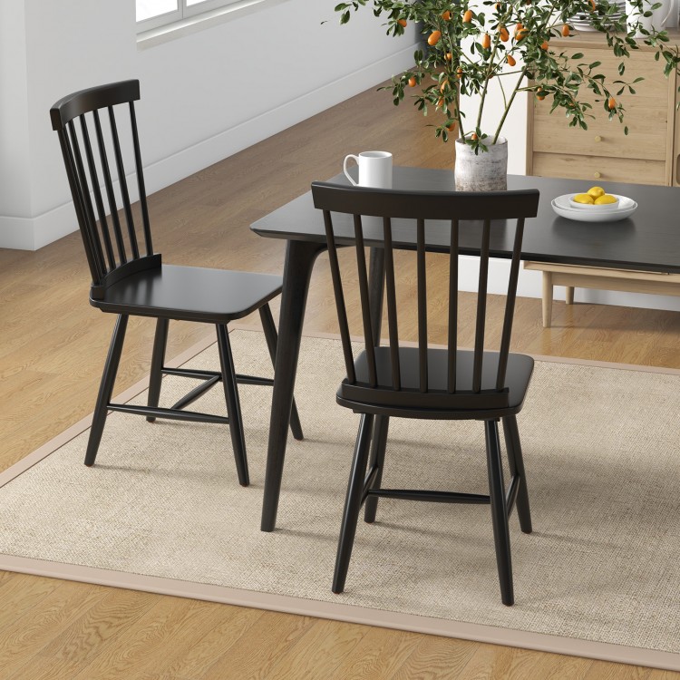 Windsor chairs and industrial sideboard in black, perfect for dining or storage in a stylish home setting.