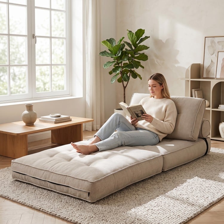 Beige 3-in-1 folding sofa with bolster, convertible to a bed, ideal for living rooms and guest rooms.