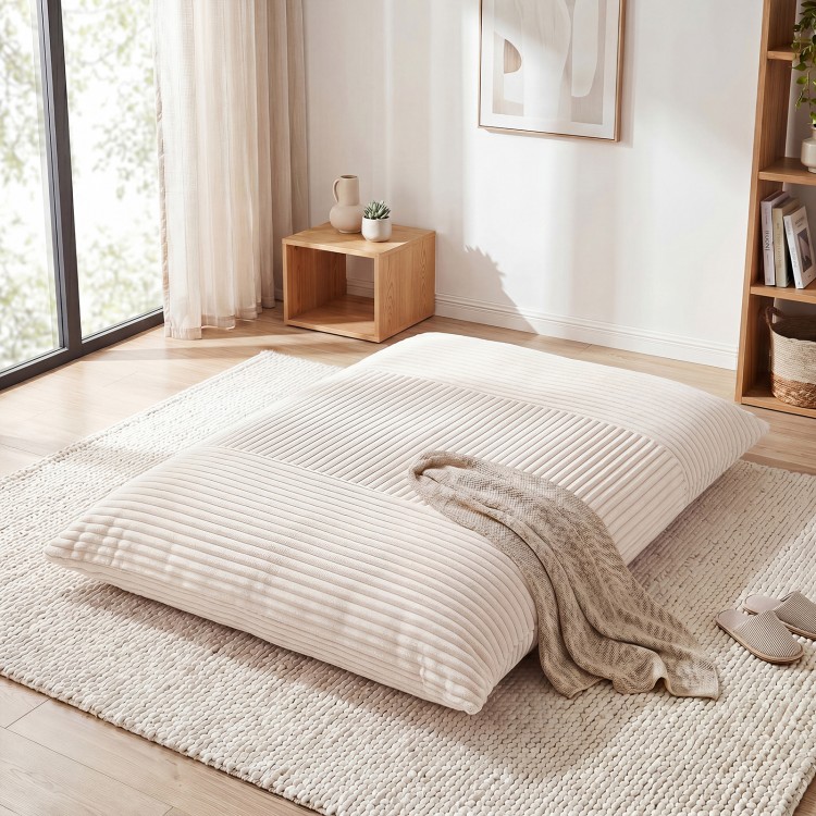 Large beige bean bag chair with soft corduroy fabric, perfect for lounging, reading, or entertaining in any room.