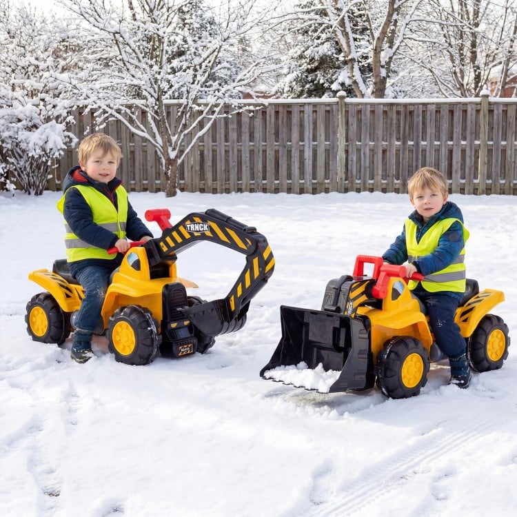 Two children riding on a 3-in-1 excavator and bulldozer in the snow, wearing safety vests and helmets.