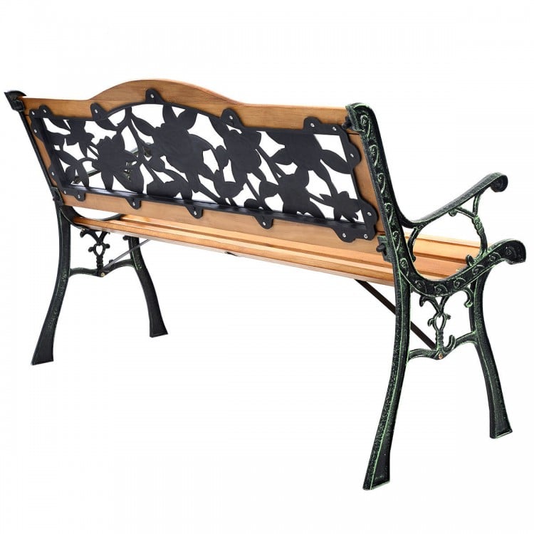 Outdoor cast iron patio bench with rose pattern backrest, solid wood seat, and sturdy design for three adults.
