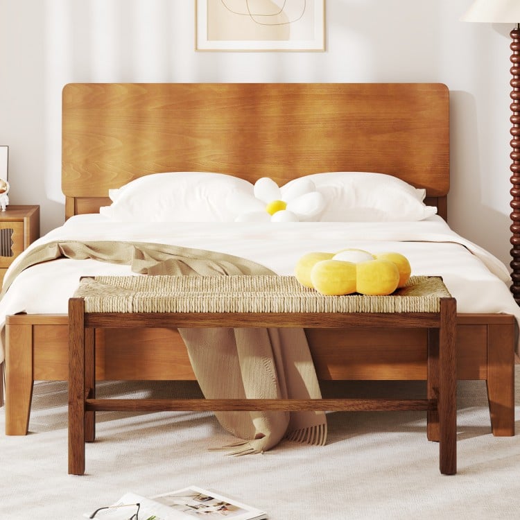 Wood bench with solid rubber wood frame in walnut finish, featuring a hand-woven seagrass seat for stylish extra.
