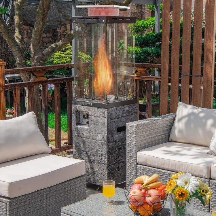 Propane patio heater with tempered glass and lockable wheels, providing warmth and style for outdoor gatherings.