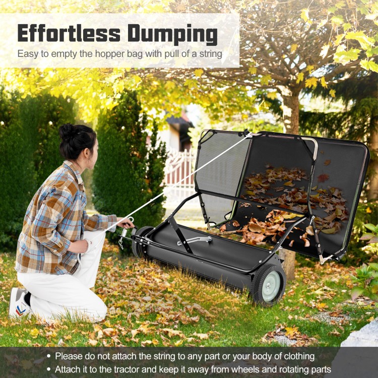 42-inch tow-behind lawn sweeper with 26/27 cu.ft hopper bag, shown in use for effortless debris collection in a garden.