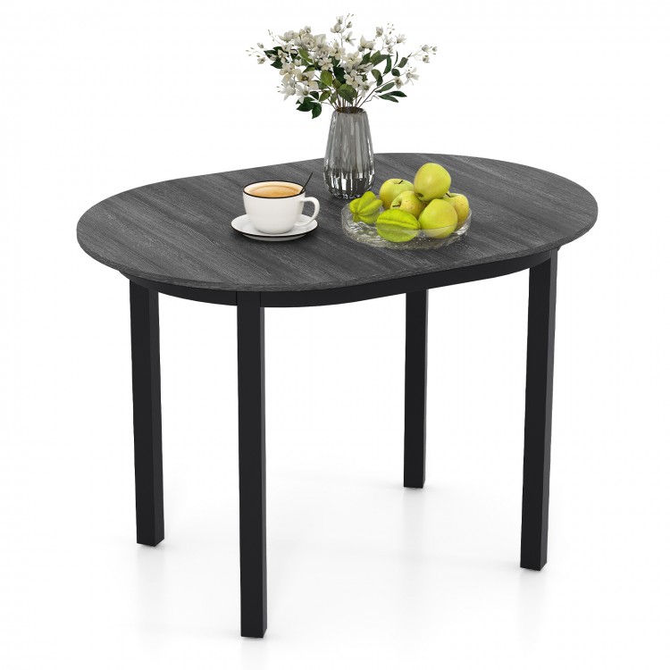 Oval dining table with a smooth dark grey finish and rubber wood legs, offering a stylish space for dining or working.
