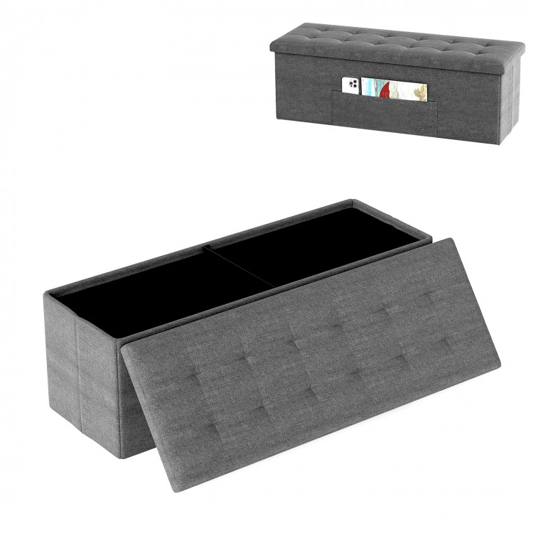 Dark gray folding storage ottoman bench with padded seat, featuring a removable divider and large capacity for.