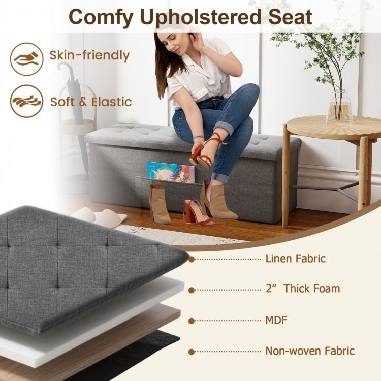 Folding storage ottoman bench in dark gray linen with padded seat, ideal for entryway or bedroom organization.