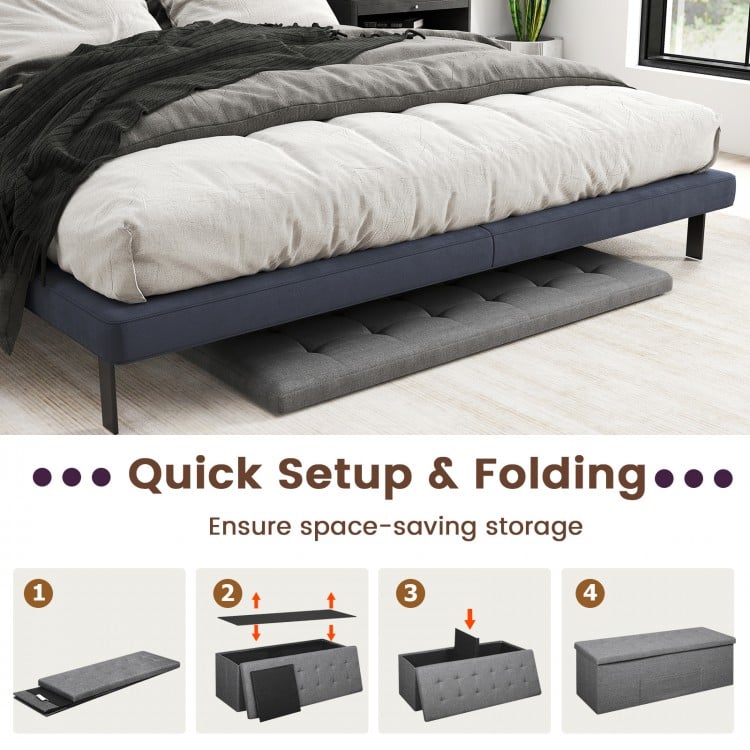 Folding storage ottoman bench in dark gray with padded seat, ideal for bedroom or living room organization and comfort.