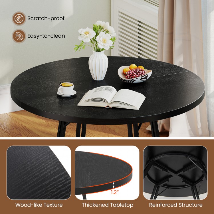Round black dining table with wood-like texture, thickened tabletop, and cross base, seats 4-6 people for stylish.