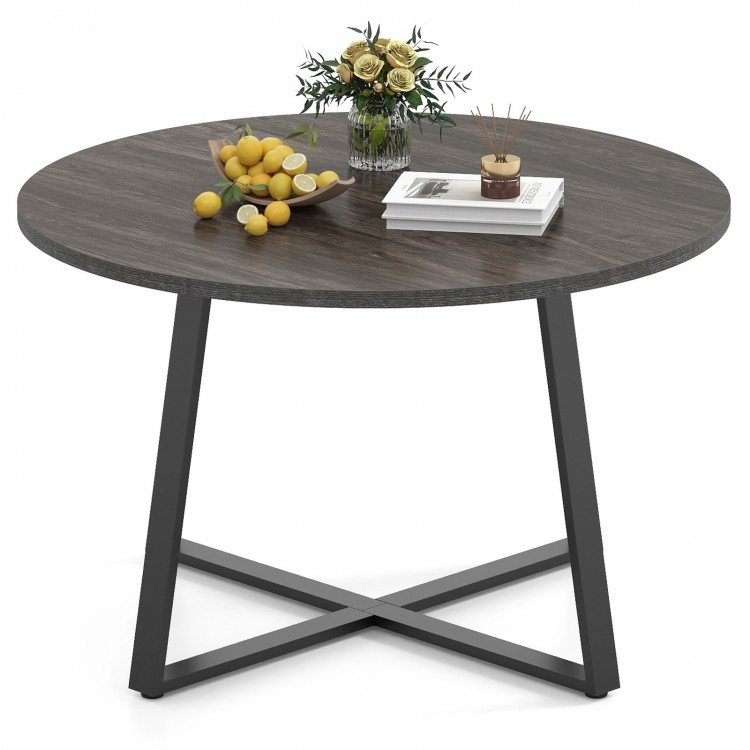 Round 47-inch dining table with a grey wood-grain surface and stable X-shaped base, perfect for various settings.