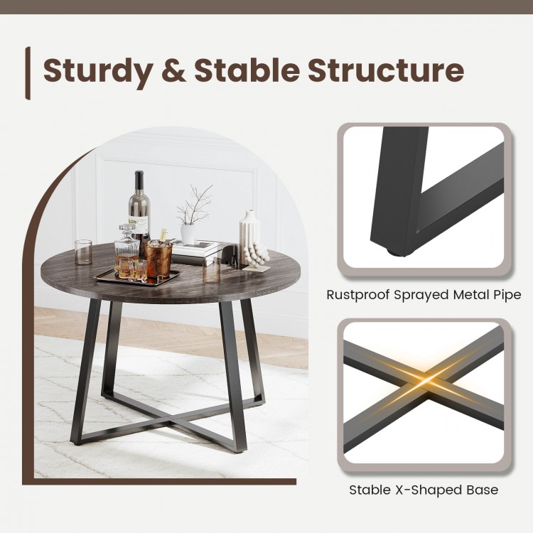 Round 47-inch dining table with a thickened grey tabletop and stable X-shaped base, perfect for various settings.