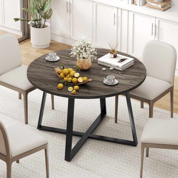 Round 47-inch dining table with a grey wood-grain surface and stable X-shaped base, ideal for various dining settings.