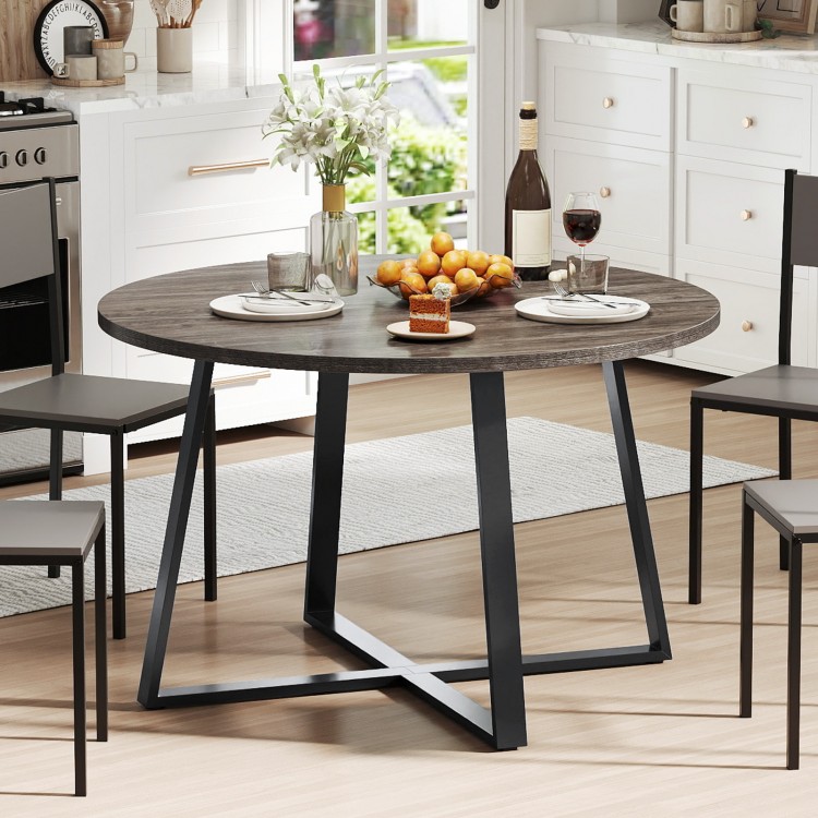 Round 47-inch dining table with a grey wood-grain surface and sturdy X-shaped base, ideal for various dining settings.