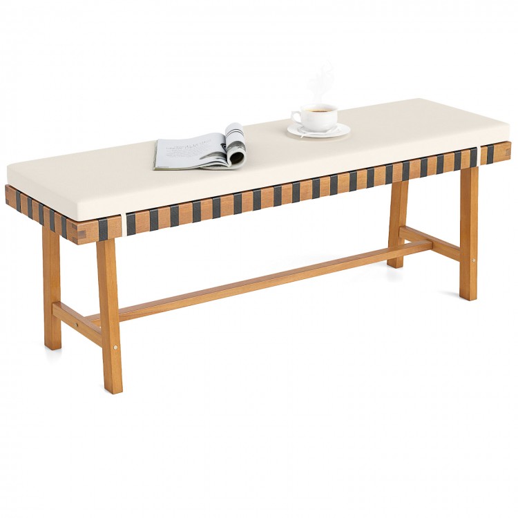 Acacia wood outdoor bench with thick padded seat cushion, ideal for garden or entryway seating.
