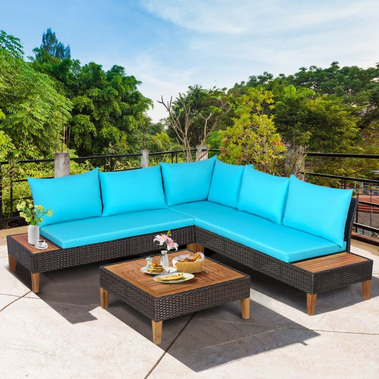 L-shaped patio sofa set with turquoise cushions, wooden side tables, and a coffee table for outdoor relaxation.