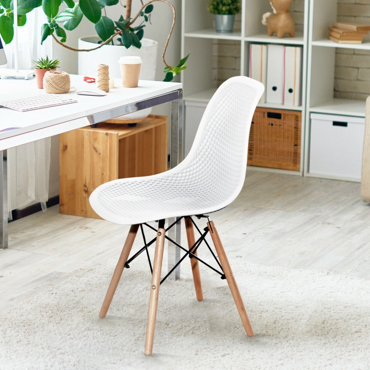 White modern plastic hollow chair with wood legs, featuring ergonomic mesh design for breathability, ideal for dining.