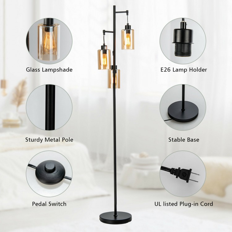 Retro floor lamp with three amber glass shades, sturdy metal pole, and foot switch for convenient lighting control.