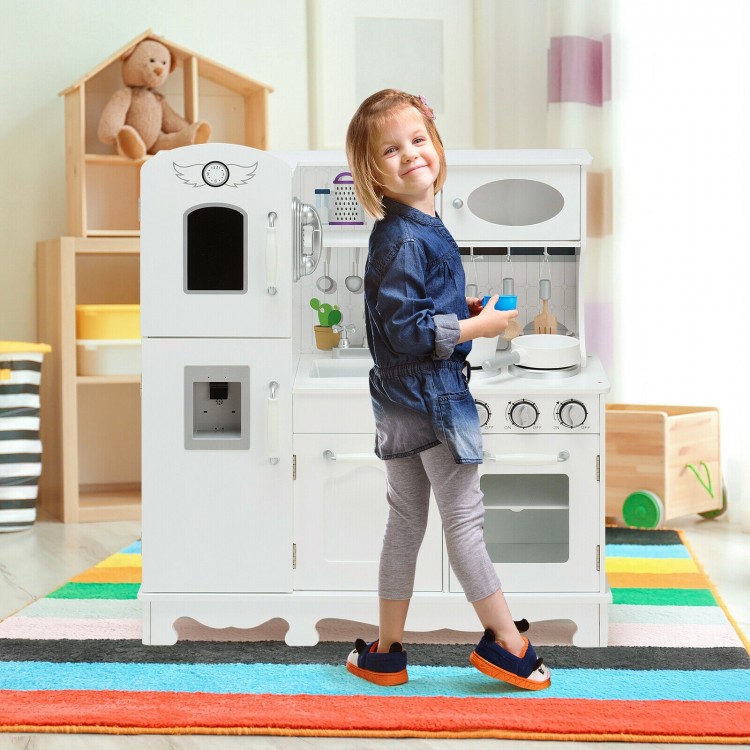 Kids playing with a white kitchen pretend play cookware set featuring a water dispenser, promoting hand-eye.