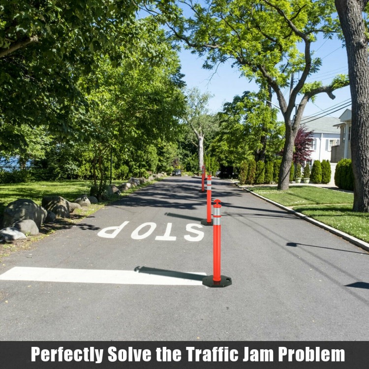 Orange traffic delineator post with reflective collars on a street, ideal for guiding traffic and enhancing safety.
