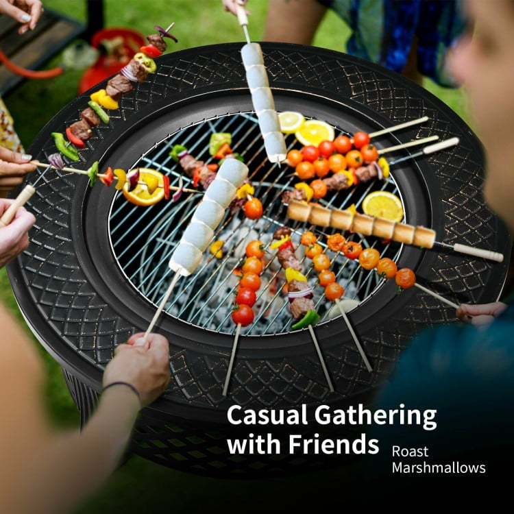 Outdoor fire pit with BBQ grill showcasing skewers and vegetables, perfect for casual gatherings in the backyard.