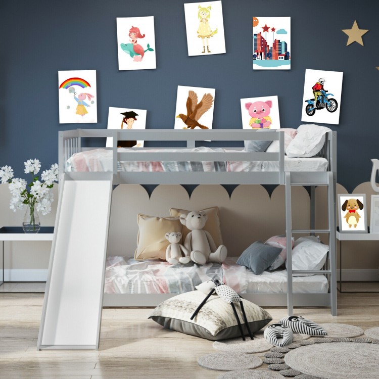 Twin over twin gray wooden bunk bed with slide, featuring a sturdy frame and safety guardrails for kids' fun and.