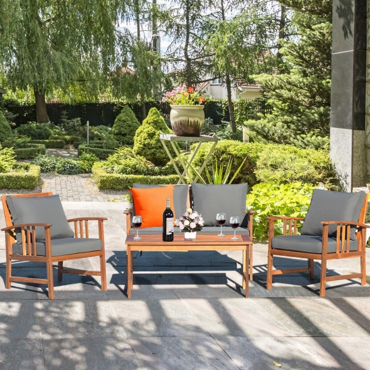 4-piece wooden patio furniture set with soft cushions, perfect for outdoor relaxation in garden or patio settings.