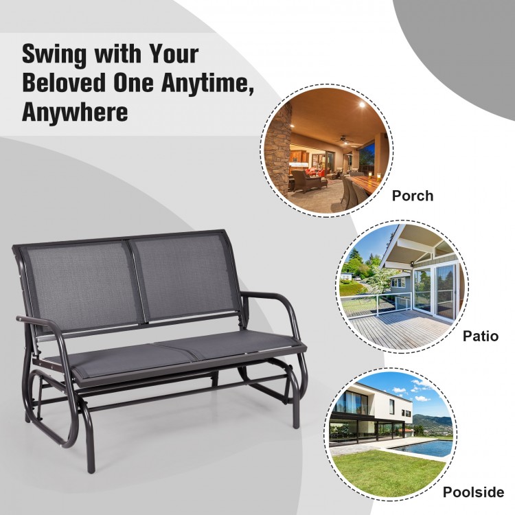 Gray 48-inch swing glider loveseat with curved backrest, sturdy steel frame, ideal for patio or backyard relaxation.