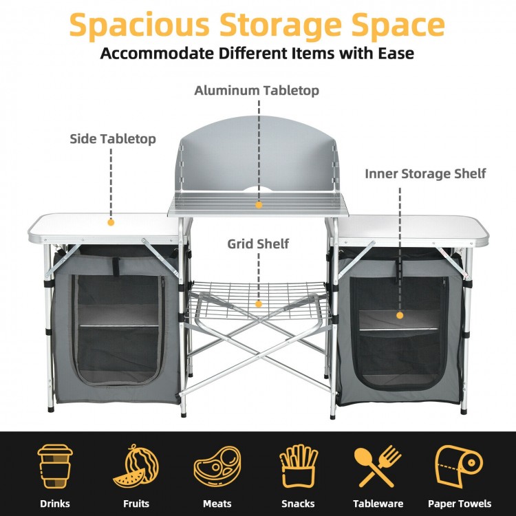 Folding camping table with gray aluminum tabletop, side tables, and storage organizer, ideal for outdoor gatherings.