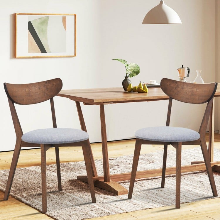 Set of 2 dining chairs with upholstered curved backs, rubber wood legs, perfect for kitchen or dining room use.