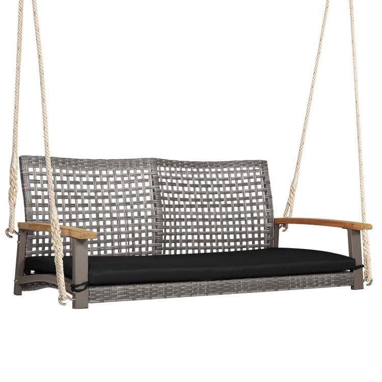 Spacious 2-person patio wicker hanging swing chair with gray PE rattan and black cushion for backyard relaxation.