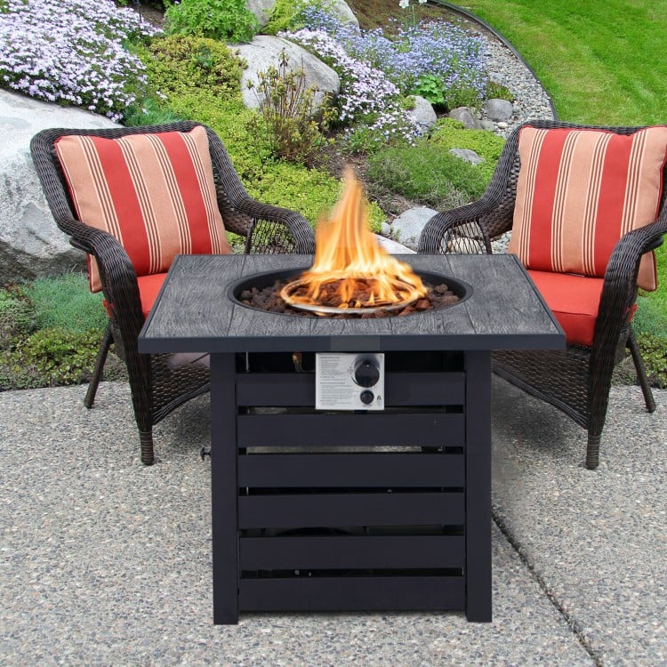 Square propane fire pit table with lava rocks, featuring a durable steel frame, ideal for outdoor patio use.