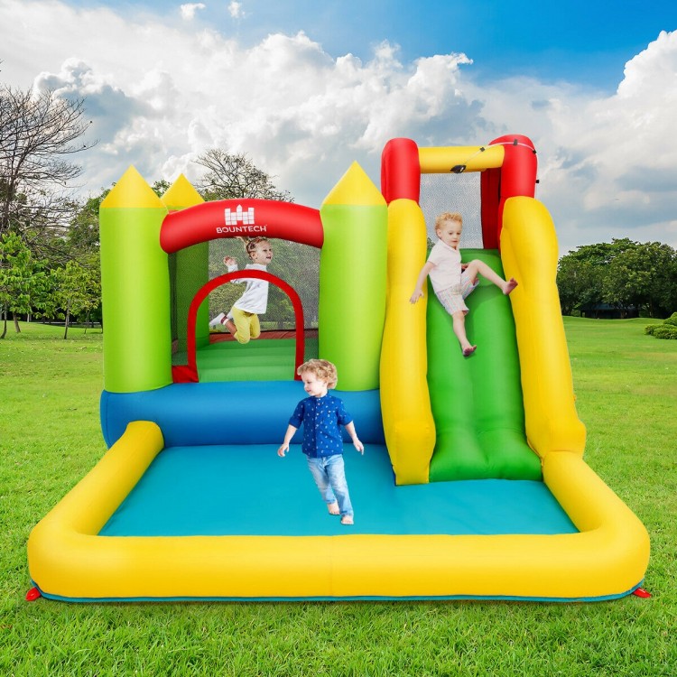 Inflatable bounce house water slide with climbing wall and splash pool, perfect for outdoor fun and exercise for kids.