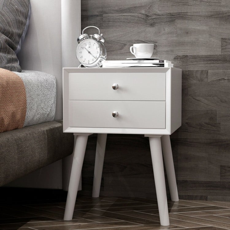White wooden nightstand with two storage drawers, featuring a sturdy design and retro style for bedroom decor.