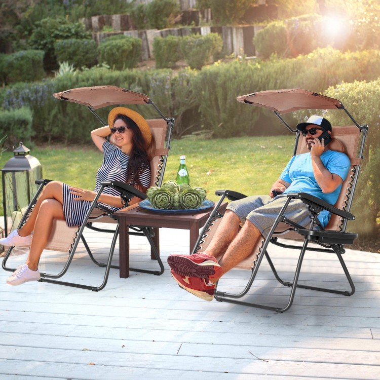 Folding recliner lounge chair with adjustable shade canopy and cup holder, perfect for outdoor relaxation and comfort.