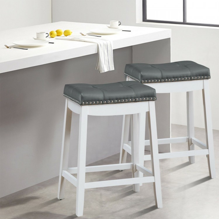 Set of 2 white nailhead saddle bar stools with soft upholstery and rubber wood legs, perfect for kitchen or dining.