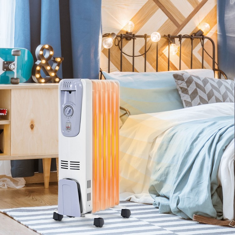 Oil-filled radiator heater with adjustable thermostat, 3 heating modes, and 4 wheels for easy movement in a bedroom.