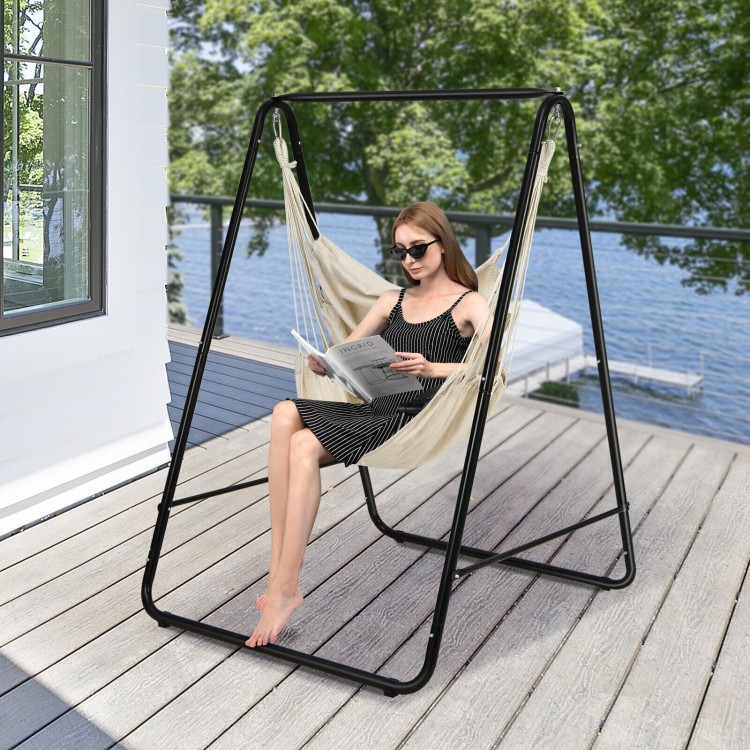 Hanging padded hammock chair with stand in beige, featuring a sturdy steel frame, ideal for indoor or outdoor.