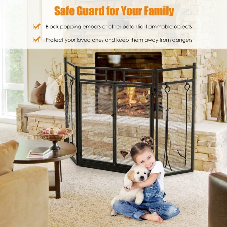 3-panel folding wrought iron fireplace screen in black with tools set, ensuring safety for children near the fire.