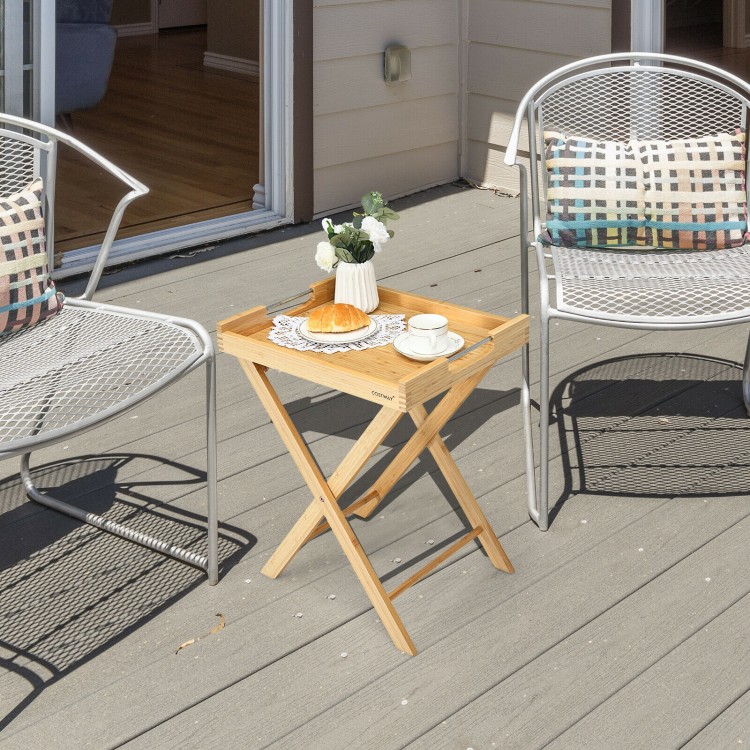Natural bamboo snack side table with removable tray, perfect for outdoor dining and compact spaces.