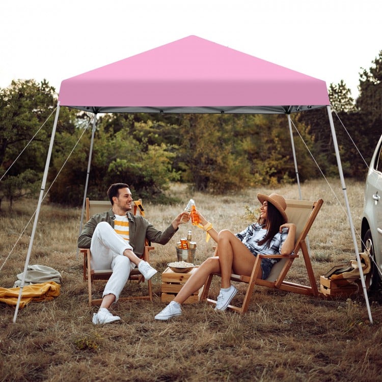 Outdoor instant pop-up canopy in pink, 10 x 10 feet, perfect for picnics and gatherings, featuring a sturdy metal frame.